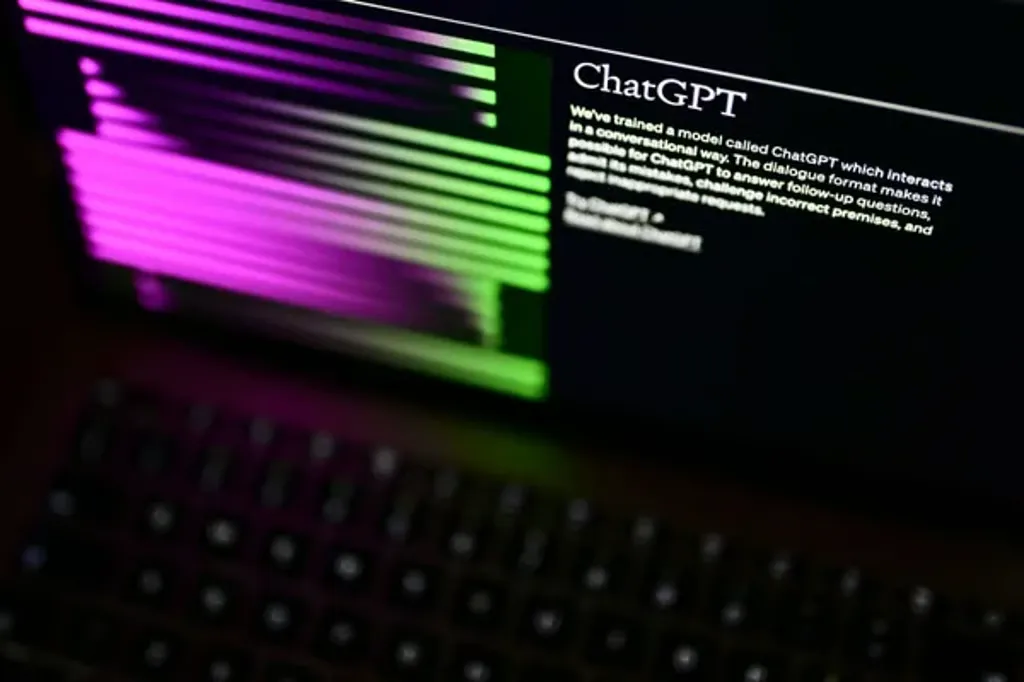 Laptop screen displaying the ChatGPT interface with colorful code lines.